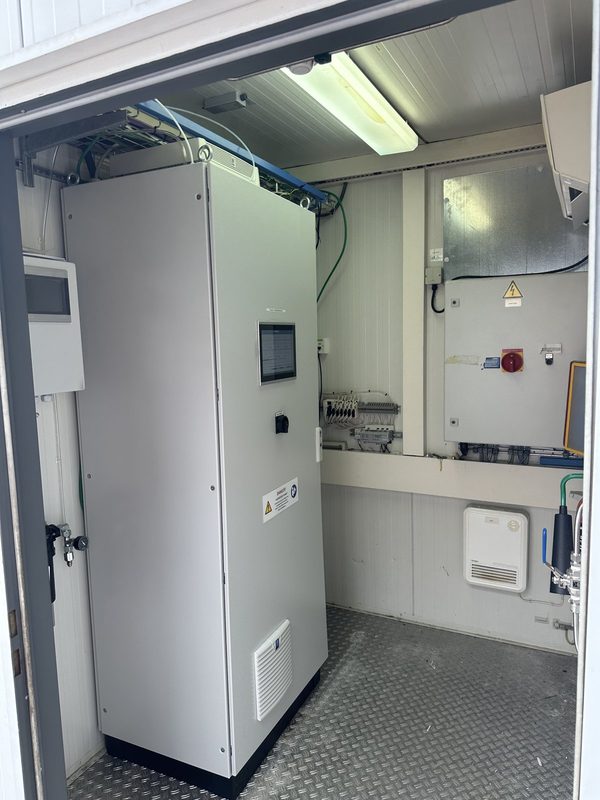 Continuous emission monitoring system cabinet and control panel inside an analyser shelter